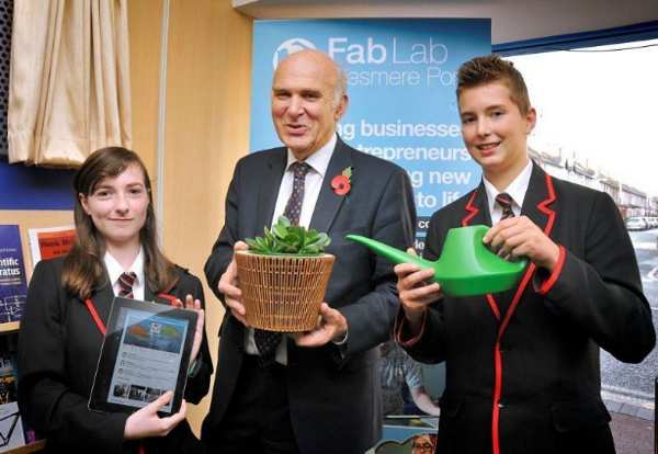 Business Secretary is presented with a tweeting plant - made at Fab Lab Ellesmere Port by local teenagers Rachel O' Toole and Patric Rabsky.