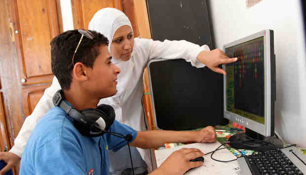 Innovators using a specialised computer. Photo: UNICEF/Giacomo Pirozzi