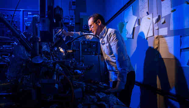 Christopher Lutz of IBM Research - Almaden in San Jose, Calif. stands with IBM's Nobel-prize winning microscope used to store data on a single atom magnet. IBM scientists used its scanning tunneling microscope to demonstrate technology that could someday store all 35 million songs on iTunes library on the area of a credit card. (Stan Olszewski for IBM)
