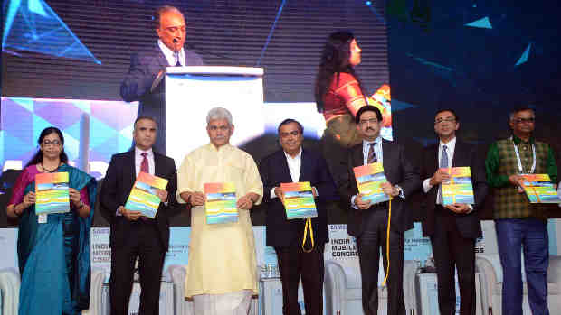 Manoj Sinha releasing the publication, at the inauguration of the India Mobile Congress - 2018, in New Delhi on October 25, 2018. The Secretary, (Telecom), Ms. Aruna Sundararajan and other dignitaries are also seen.