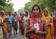 AI-generated representational image of men and women standing outside a polling booth to vote in an Indian election. Photo: RMN News Service