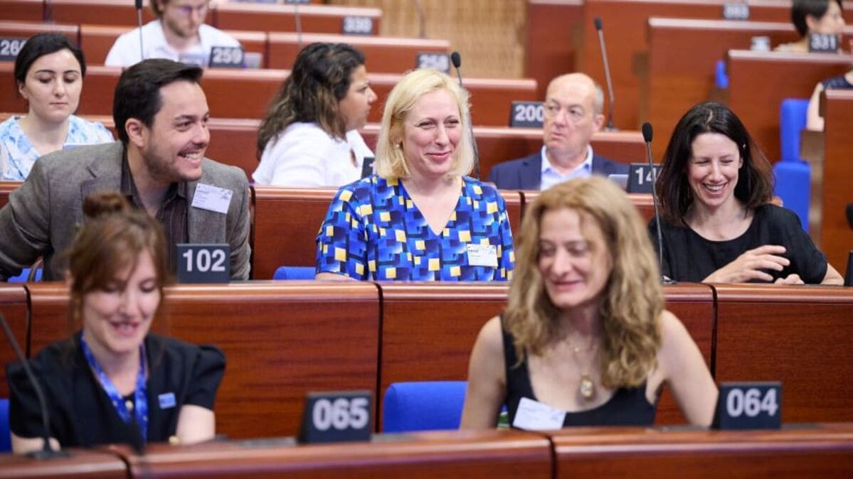 Stakeholders and educators discussing the future of digital citizenship education at a Council of Europe forum in Strasbourg.